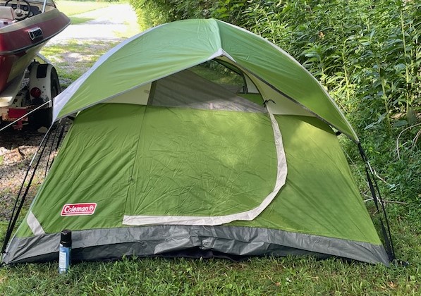 My 2-person green and gray Coleman tent set up in the yard.